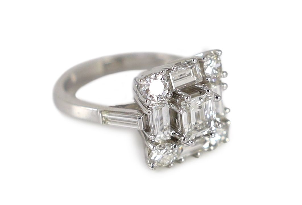 A square, baguette and round cut diamond set square cluster ring